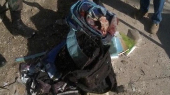 A bloody school bag outside the school in Damascus