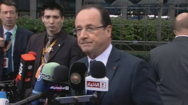 French President Francois Hollande speaking to reporters outside the EU summit