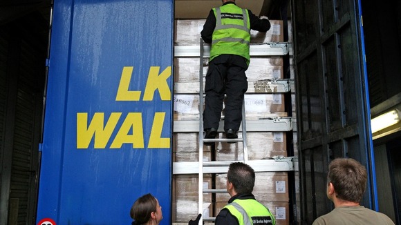 UK Border Control search a lorry trailer for stowaway passengers at Calais Ferry Port in France. Picture date: Monday June 6, 2011.