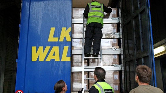 UK Border Control search a lorry trailer for stowaway passengers at Calais Ferry Port in France. Picture date: Monday June 6, 2011.