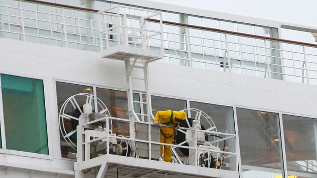 Cleaners prepare to wash the outside of the Oriana while the ship is docked in Southampton