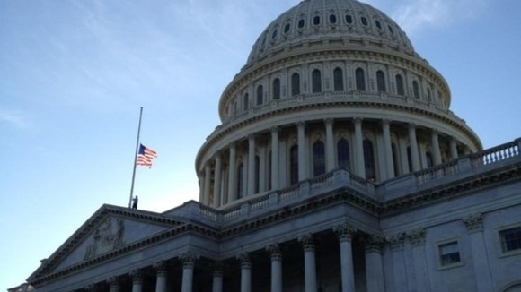 The American flag has been lowered on Capitol Hill in tribute to the victims of the Connecticut mass shooting.