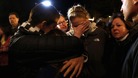People grieve outside the vigil at the Saint Rose of Lima church in Newtown, Connecticut