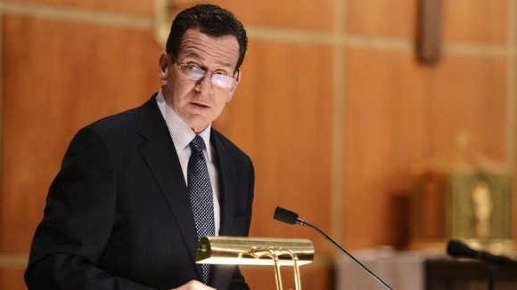 Dannel Malloy, Governor of Connecticut speaks to mourners gathererd inside the St. Rose of Lima Roman Catholic Churc
