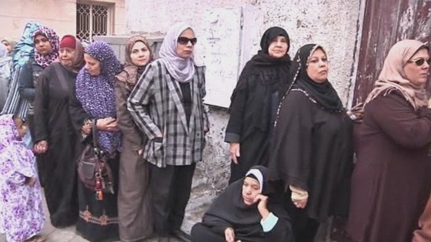 Egyptians queue to cast their ballot in the first of a two-stage referendum