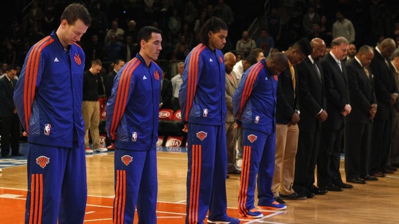 Members of the New York Knicks observe a moment of silence
