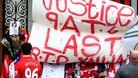 Tributes placed on the Shankly Gates next to the Hillsborough Memorial at Liverpool's Anfield Stadium