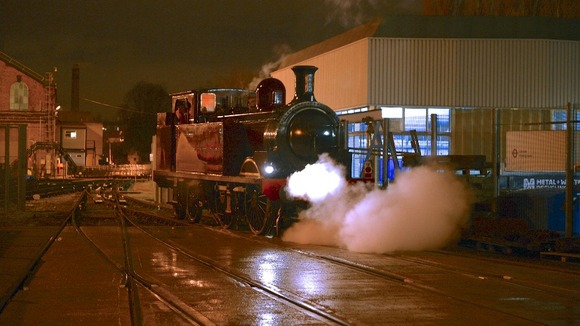 Steam train on tracks.