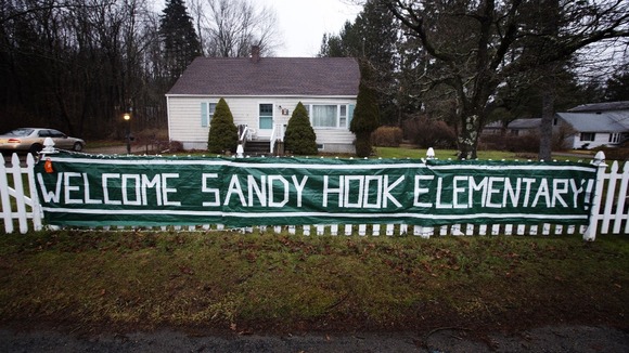 A welcome sign hangs outside of the entrance for Chalk Hill Middle