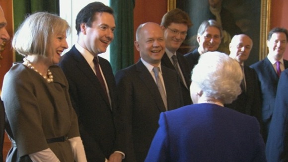 The Queen shares a joke with members of the Cabinet