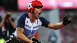 Great Britain's David Weir pumps his fist after winning gold in the men's 1500m T54 final