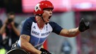 Great Britain's David Weir pumps his fist after winning gold in the men's 1500m T54 final