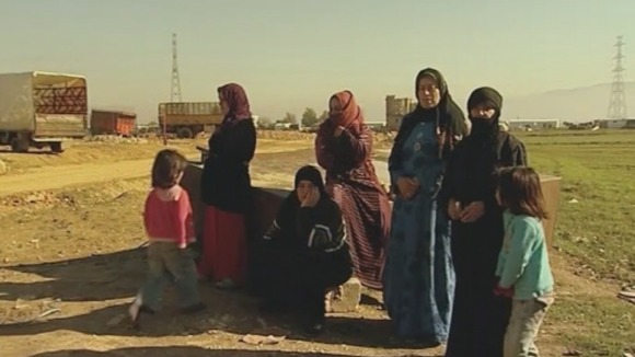 Women and children in Lebanon after fleeing Syria