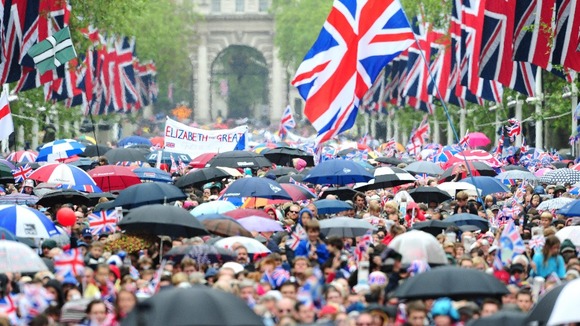 The crowd comes down The Mall to see the Queen on the balcony of Buckingham Palace