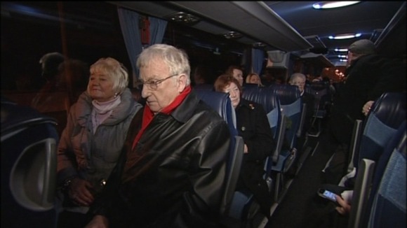 On the road to justice. Families leave Liverpool for the hearing at the High Court.