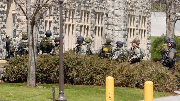 Law enforcement officers enter a hall on the Virginia Tech campus , April 16, 2007