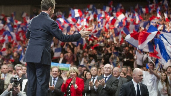 Nicolas Sarkózy arrives on stage during a political rally in Nancy