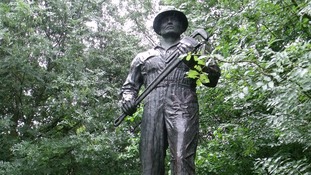 Bronze statue of the The Oil Patch Warrior which commemorates the American 'Roughnecks of Sherwood Forest'