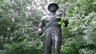Bronze statue of the The Oil Patch Warrior which commemorates the American 'Roughnecks of Sherwood Forest'