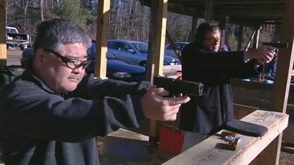A member of a shooting range in practice