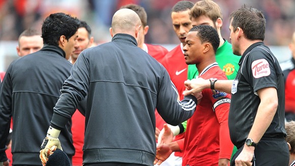 Luis Suarez and Patrice Evra