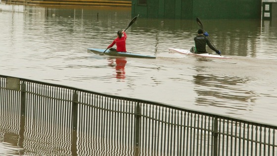 Kayakers train on a flooded Worcester Racecourse.