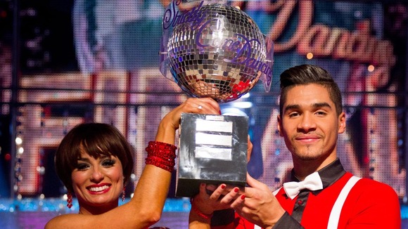 Strictly winner Louis Smith and Flavia Cacace holding the glitterball trophy.