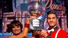 Strictly winner Louis Smith and Flavia Cacace holding the glitterball trophy.
