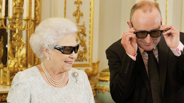 Producer John McAndrew with the Queen watching the broadcast in 3D glasses