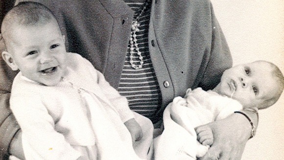 Westley Grey and his twin baby brother David in the arms of their mother Thomasina