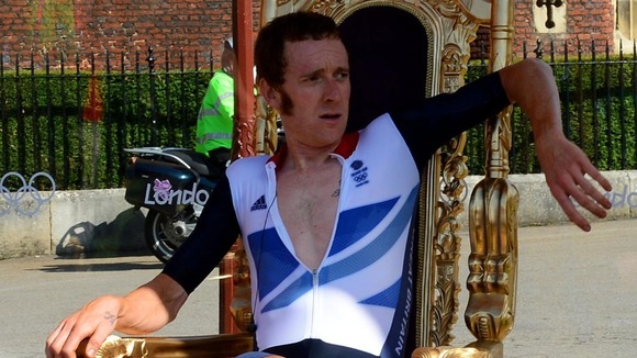 Bradley Wiggins sits on his throne after winning the Men's Individual Time Tria