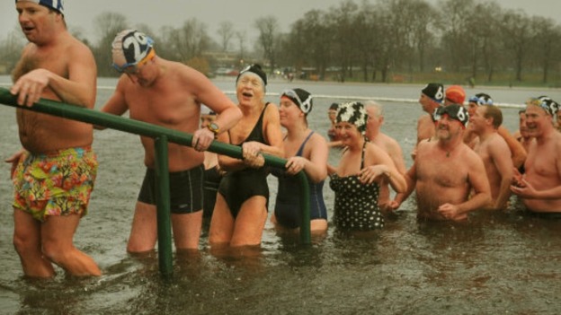 Swimmers feel the cold after their early morning Christmas swim