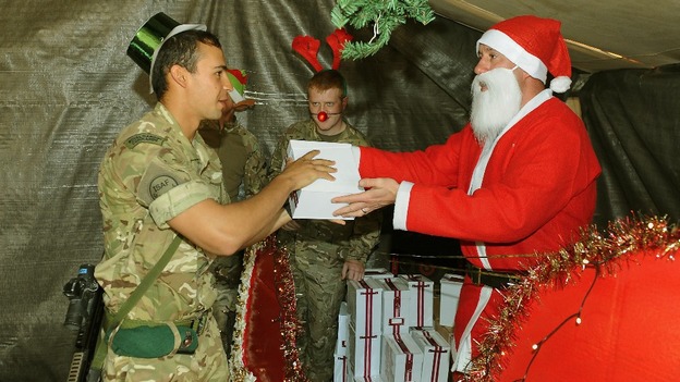 'Santa' hands out Christmas presents to British troops
