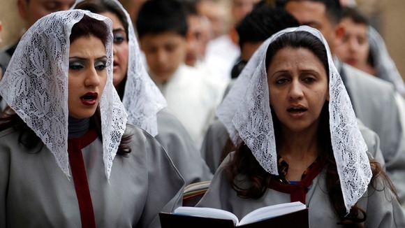 Iraqi Christians pray during a mass at St. Joseph Chaldean church in Baghdad