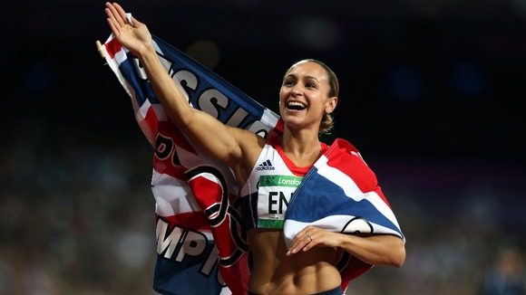 Jessica Ennis waves to the crowd after victory in the Heptathlon