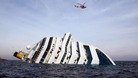 The Costa Concordia lies on her side in the Mediteranean Sea