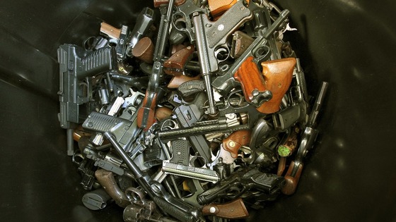 Hundreds of hand guns were turned in by their owners at an amnesty event in Los Angeles.