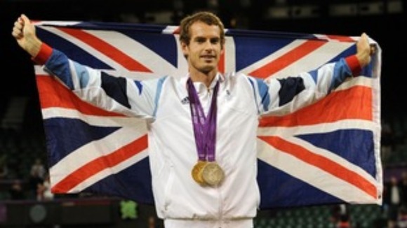 Andy Murray celebrates his Olympic medals