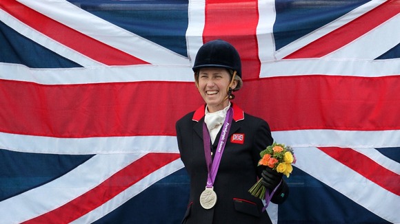 Deborah Criddle celebrates winning silver in the Dressage Individual Championship Grade 4 at Greenwich Park, London.