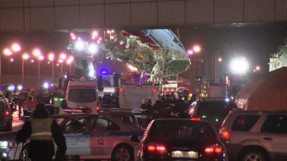The remains of the plane have been put on to flat bed trucks and removed from the airport