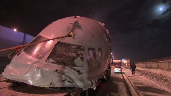 The remains of the plane have been put on to flat bed trucks and removed from the airport