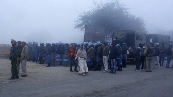 Mourners arrive for the cremation of the 23-year-old girl