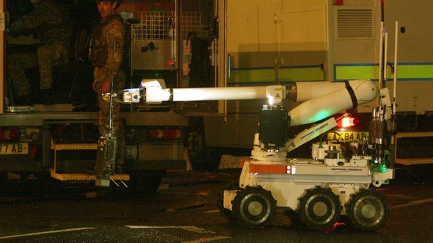 An army bomb disposal expert prepares to move in to examine the device