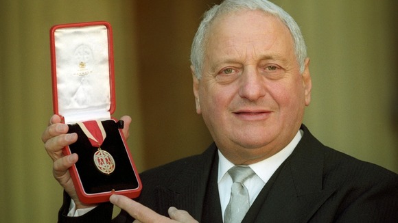 Sir Irvine Patnick pictured receiving his knighthood at Buckingham Palace in 1994