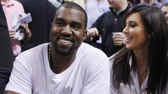 Rap musician West and Kardashian watch basketball in Miami on December 6