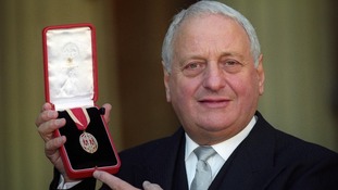 Sir Irvine Patnick receiving his knighthood at Buckingham Palace in 1994