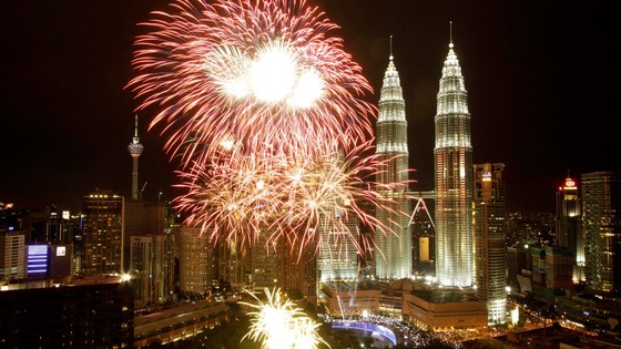 Malaysia's landmark Petronas Twin Towers are lit by fireworks as part of New Year celebrations in Kuala Lumpur