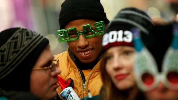 Revellers gather in Time Square before celebrating the New Year in New York