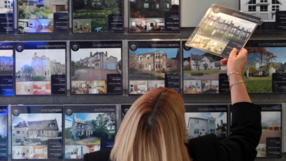 A woman looking at houses