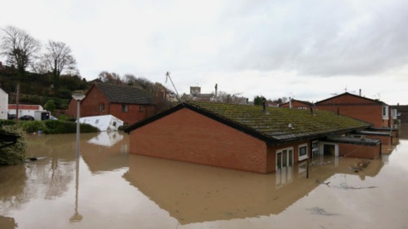 Flood waters come close to covering houses in St. Asaph, Denbighshire, North Wales